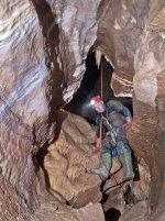 Rob Harper entering fossil vadose pasasge from the chamber in Ceiling Around.jpg