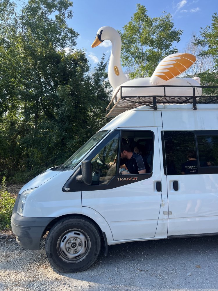 The minibus carrying the precious cargo of our luxury swan